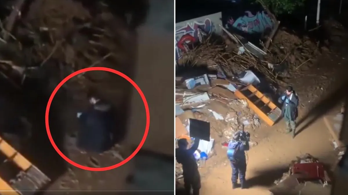 Un notero de TV genera controversia al ensuciarse con barro en Valencia.